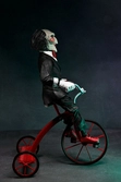 Saw figurine sonore billy with tricycle 30 cm